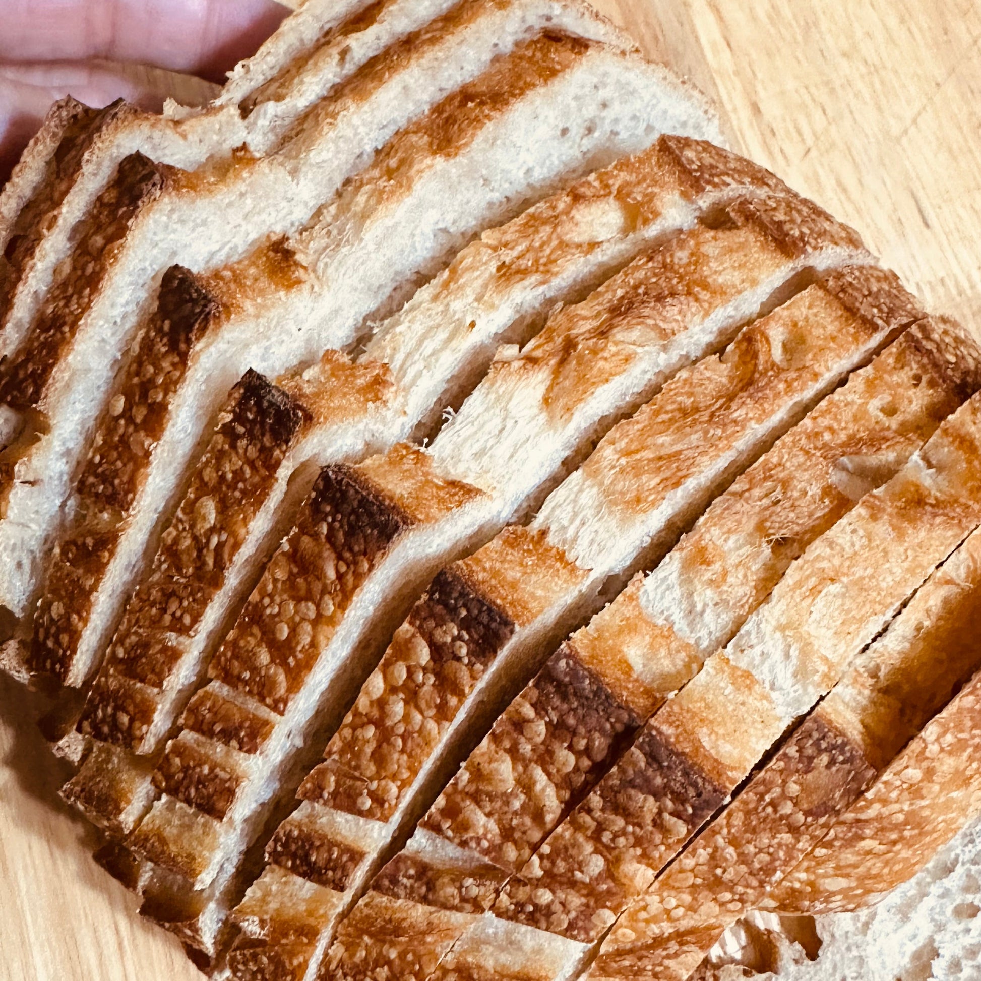 Fresh sliced artisan sourdough bread from Stirred By God